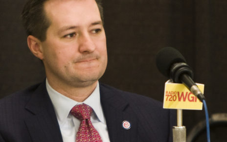 Tom Ricketts answers questions at a press conference.