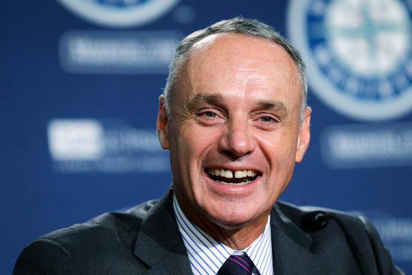 Rob Manfred laughing at how much he hates baseball.