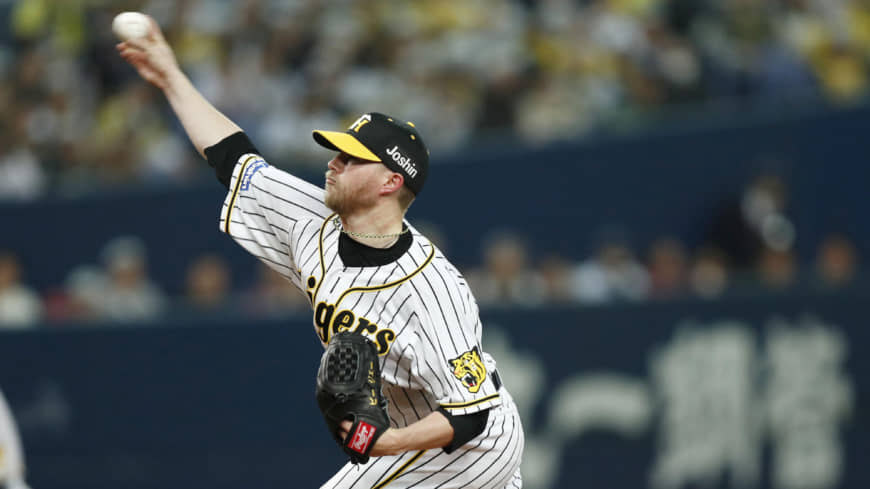Pierce Johnson delivers a pitch for the Hanshin Tigers.