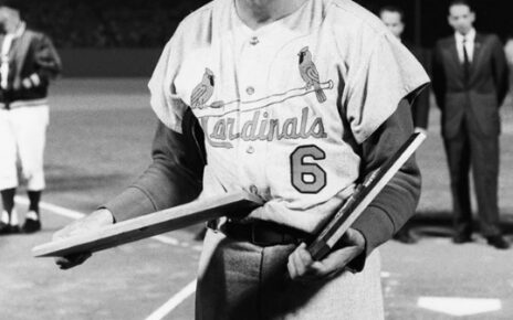 Stan Musial poses for a picture.