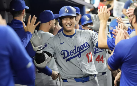 Shohei Ohtani celebrating in the Dodgers dugout.