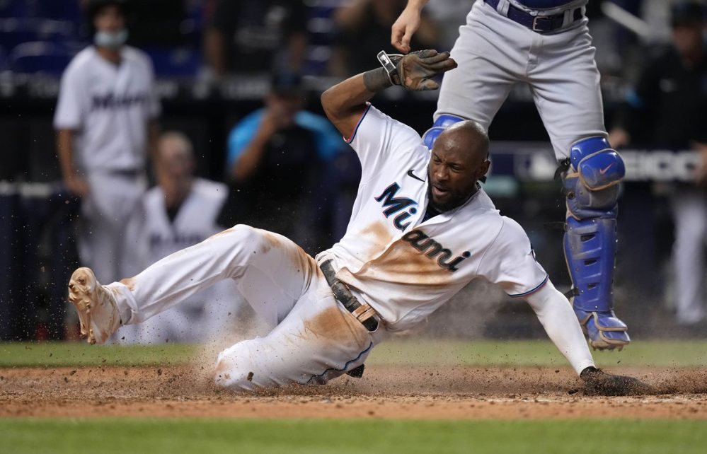 Starling Marte scores on a wild pitch.