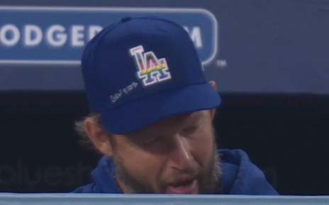 Still of a Fox Sports West broadcast that shows Clayton Kershaw's Pride Night hat with a bible verse written on it.