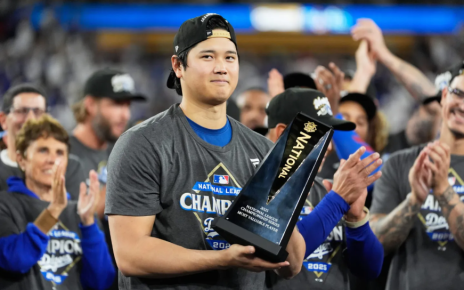 Shohei Ohtani holding his 2025 NLCS MVP award.