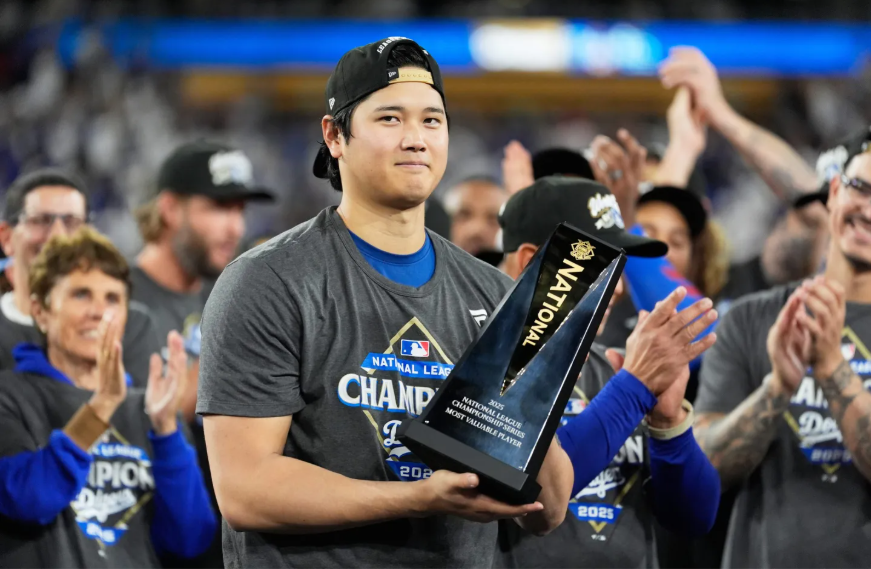 Shohei Ohtani holding his 2025 NLCS MVP award.